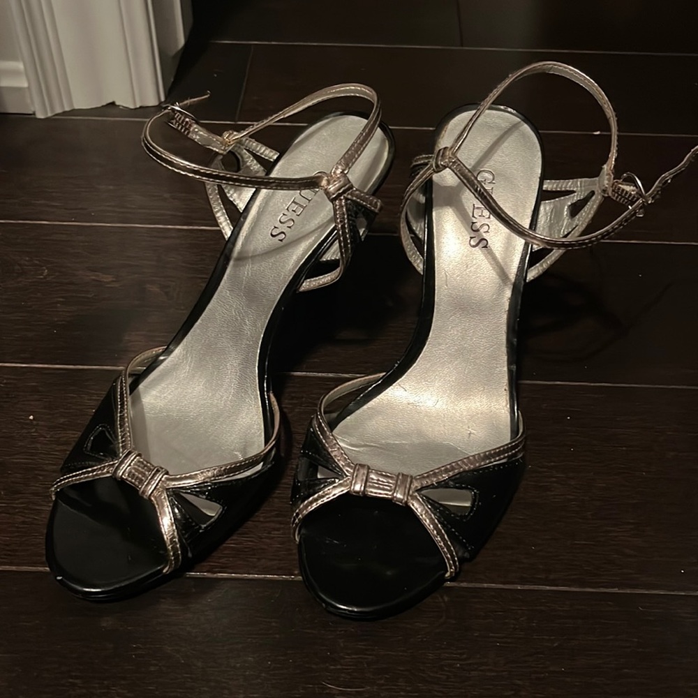 Black and metallic Guess size 6.5 wedge with strap. Only worn once.